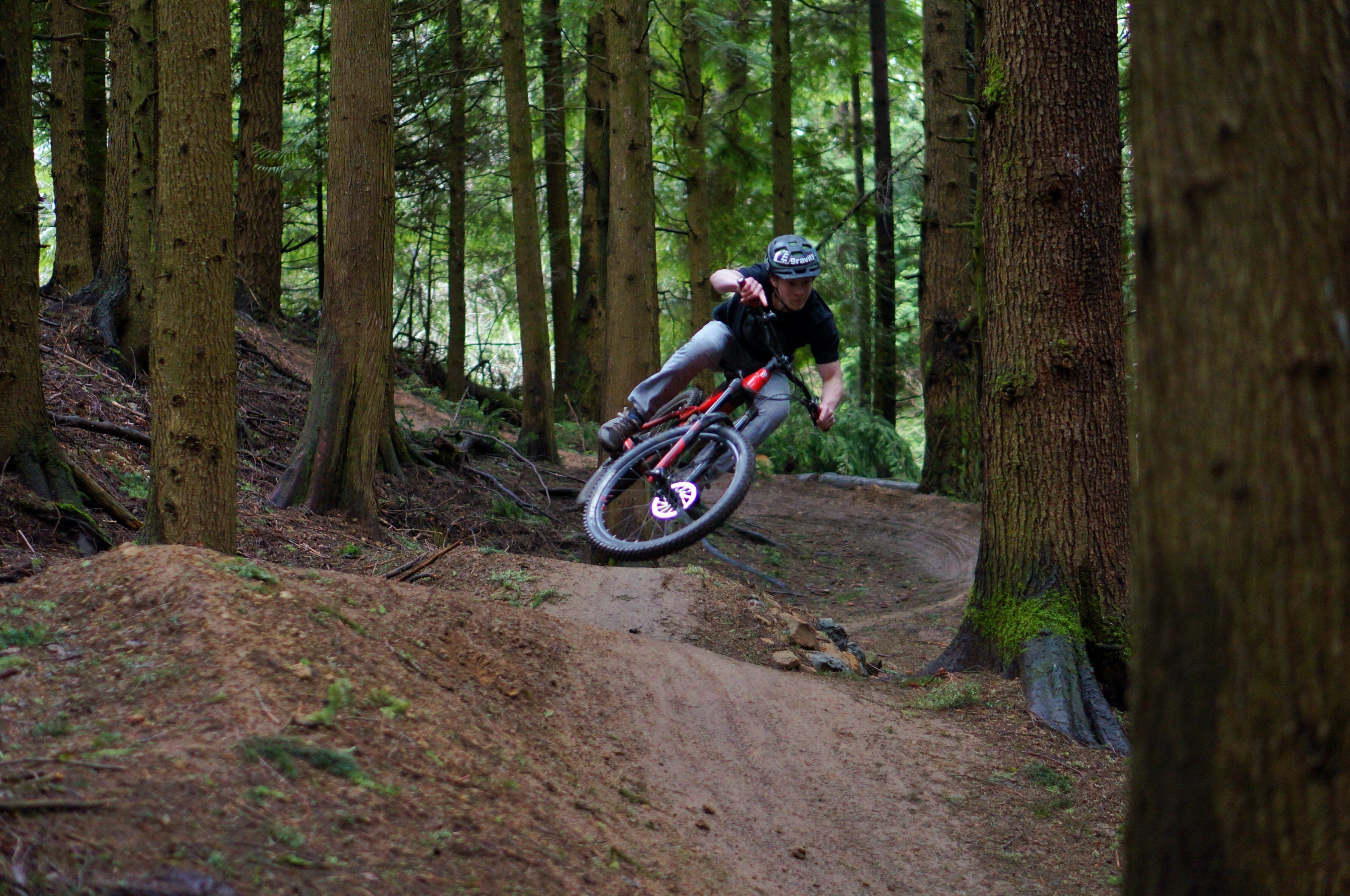 Man mountain biking down a hill