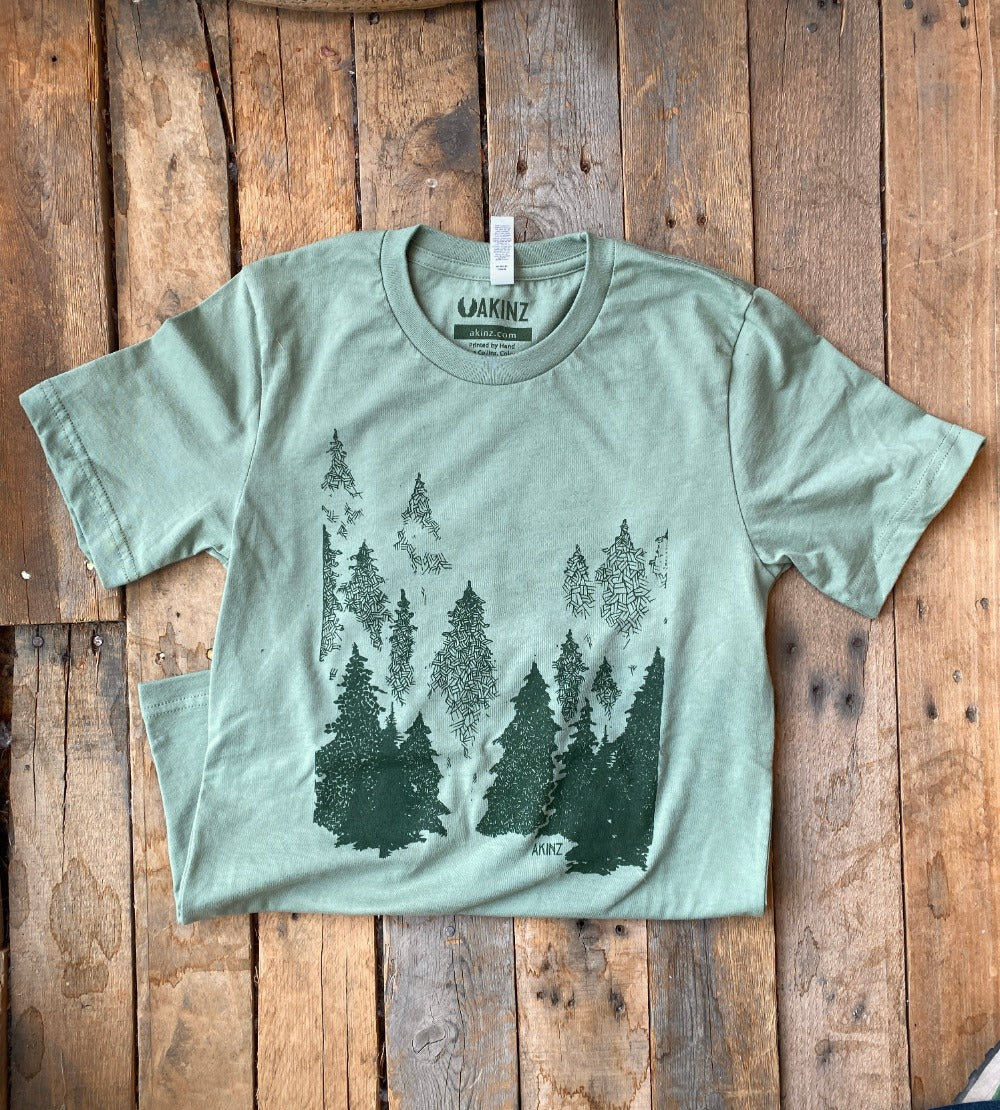 into the evergreen trees tee in green