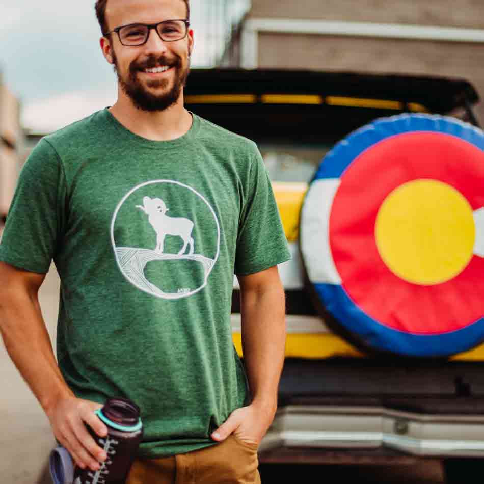 Man wearing green tshirt with ram design