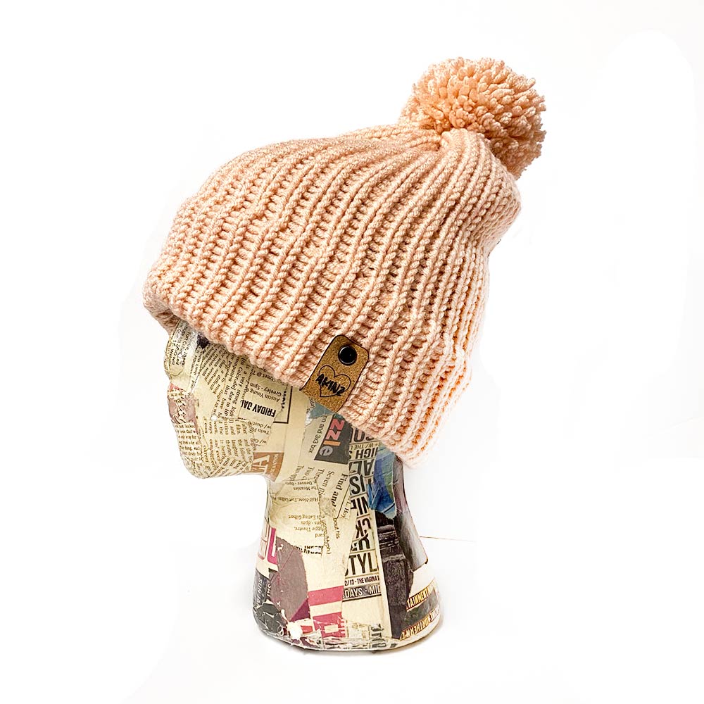 womens knitted pink beanie with pom pom