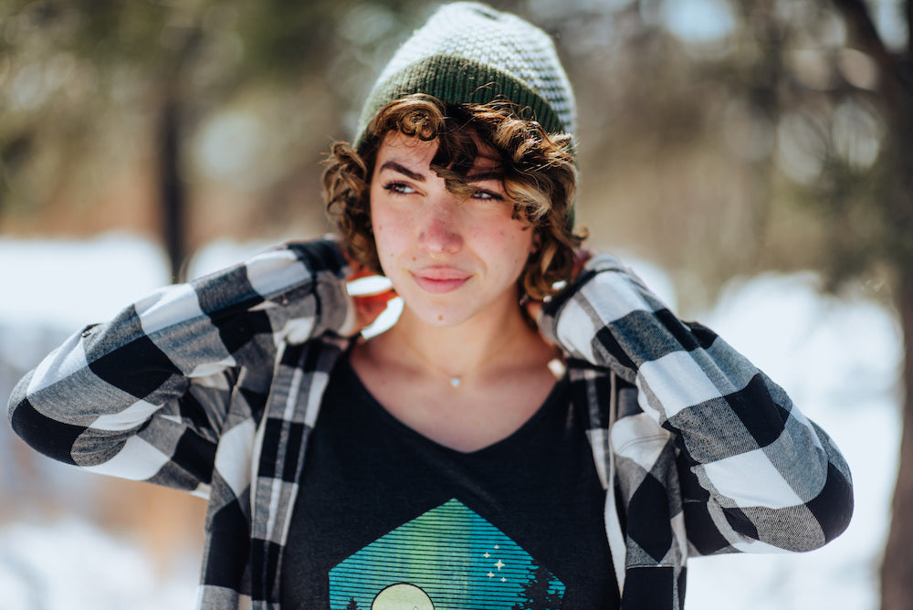girl wearing green and cream bristlecone knitted beanie and five star view scoopneck