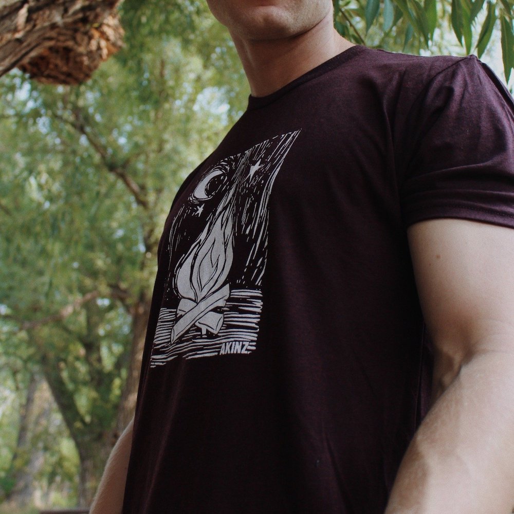 man wearing maroon campfire camping shirt