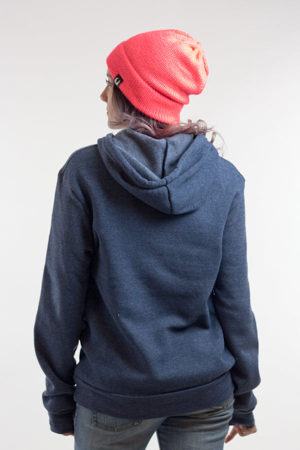 woman wearing navy blue colorado flag fleece unisex sweatshirt and pink knitted beanie