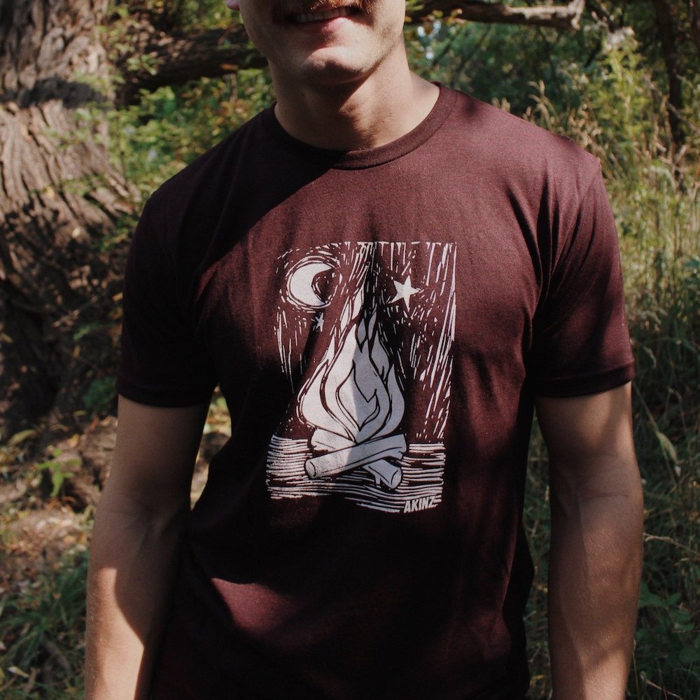 man wearing maroon campfire camping shirt