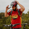 Mountain biker adjusting his helmet