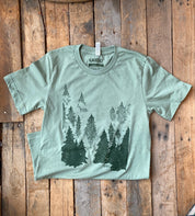 into the evergreen trees tee in green
