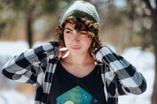 girl wearing green and cream bristlecone knitted beanie and five star view scoopneck