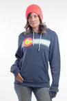 woman wearing navy blue colorado flag fleece unisex sweatshirt and pink knitted beanie